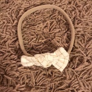 White and gold baby bow